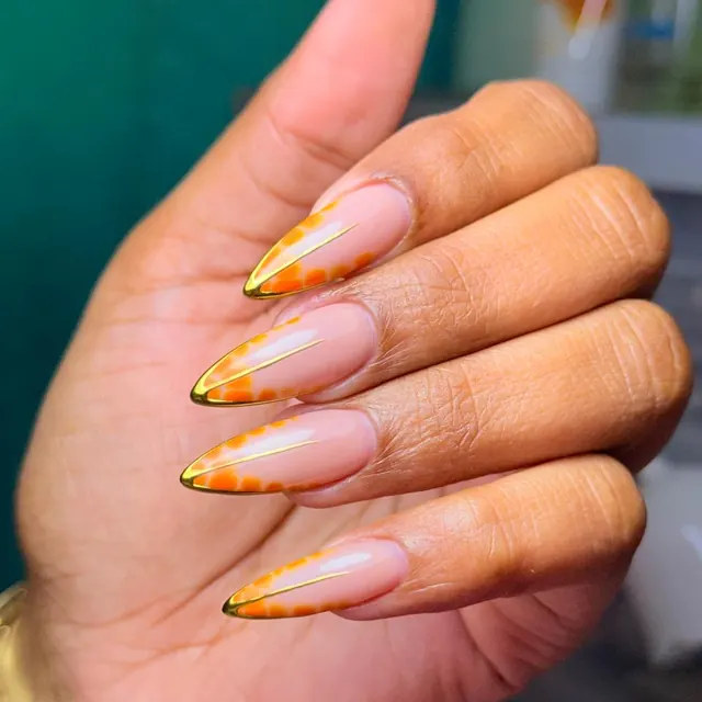 A full set of almond extensions in a warm gold ombre.